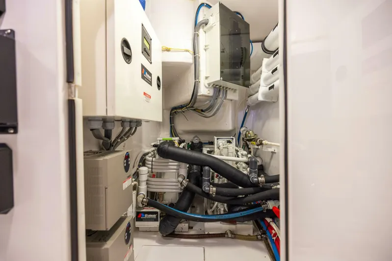 Mighty Mouse Yacht Photos Pics Engine room of 2011 Viking 70 Convertible yacht with mechanical equipment and wiring.