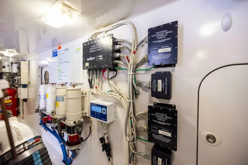 Mighty Mouse Yacht Photos Pics Engine room of 2011 Viking 70 Convertible yacht with control panels and wiring.