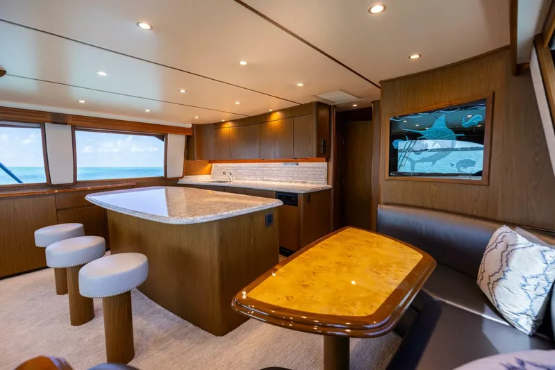 Mighty Mouse Yacht Photos Pics Luxurious interior of a 2011 Viking 70 Convertible yacht with modern kitchen and seating area.