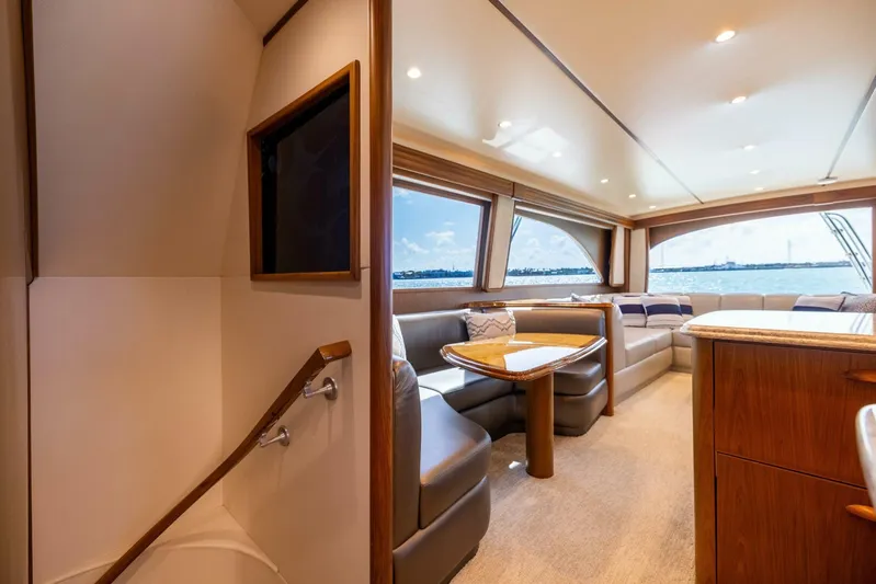 Mighty Mouse Yacht Photos Pics Luxurious interior of 2011 Viking 70 Convertible yacht with plush seating and ocean view.