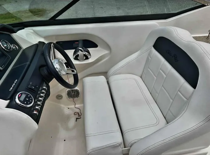  Yacht Photos Pics 2015 Sea Ray 300 SLX cockpit with white leather seating and modern controls.