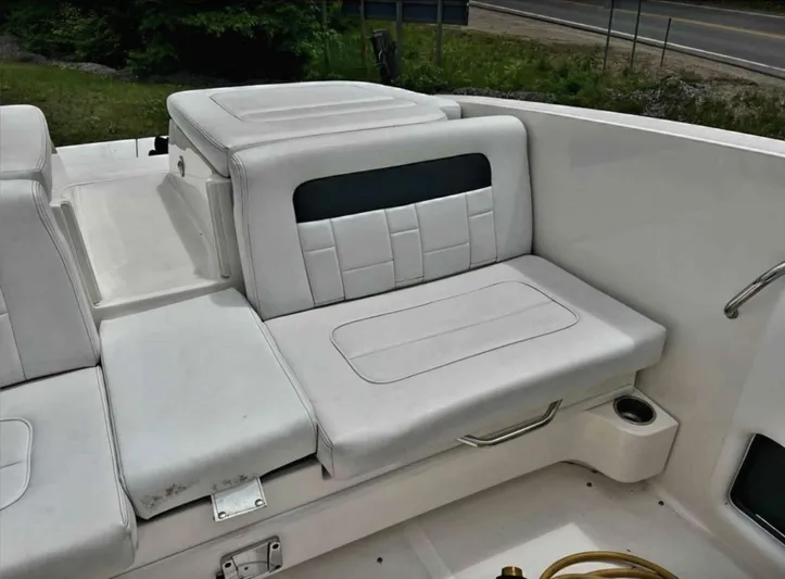  Yacht Photos Pics 2015 Sea Ray 300 SLX boat interior with white seating and cup holder.