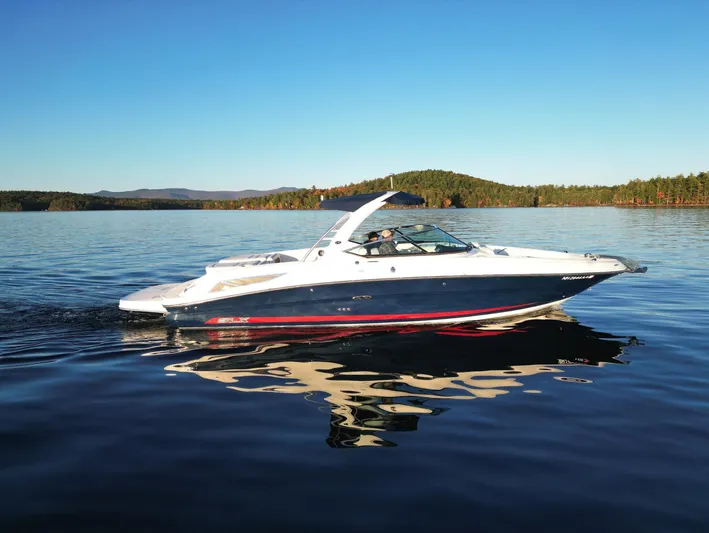  Yacht Photos Pics 2015 Sea Ray 300 SLX boat cruising on a serene lake.