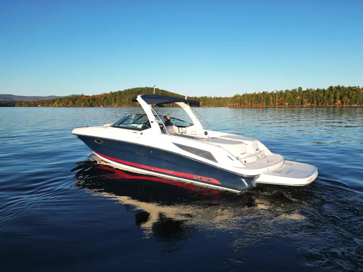  Yacht Photos Pics 2015 Sea Ray 300 SLX boat cruising on a calm lake.