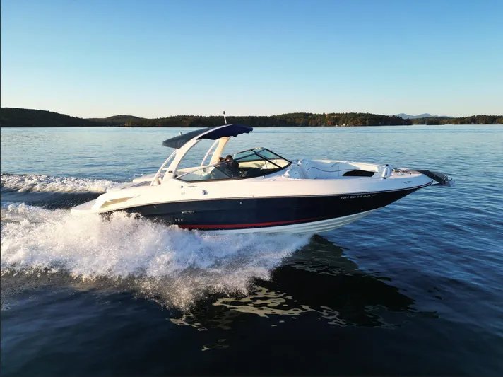  Yacht Photos Pics 2015 Sea Ray 300 SLX speedboat cruising on a serene lake.