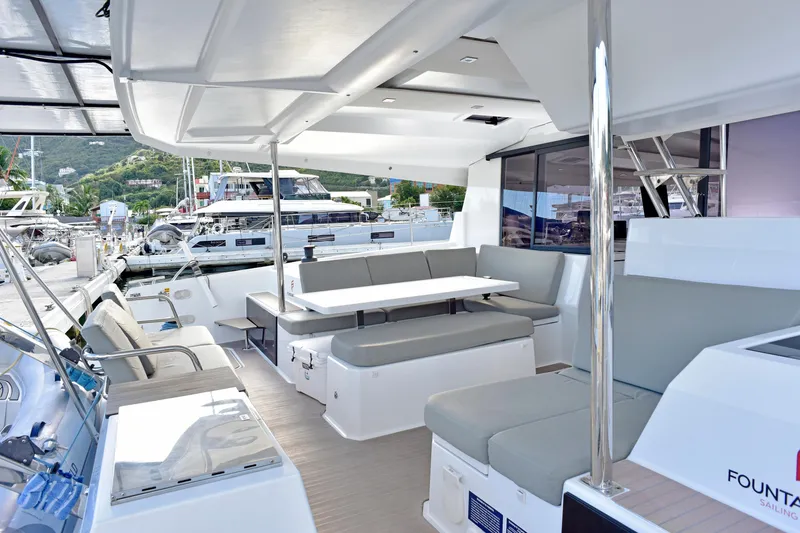 Boomerang Yacht Photos Pics Luxurious 2022 Fountaine Pajot Astrea 42 catamaran interior with spacious seating and modern design.