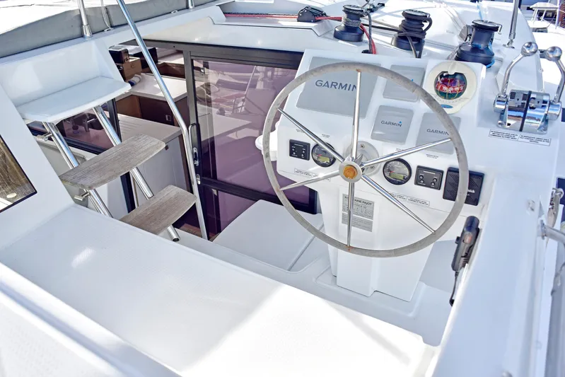 Boomerang Yacht Photos Pics Cockpit of 2022 Fountaine Pajot Astrea 42 with Garmin navigation system and steering wheel.
