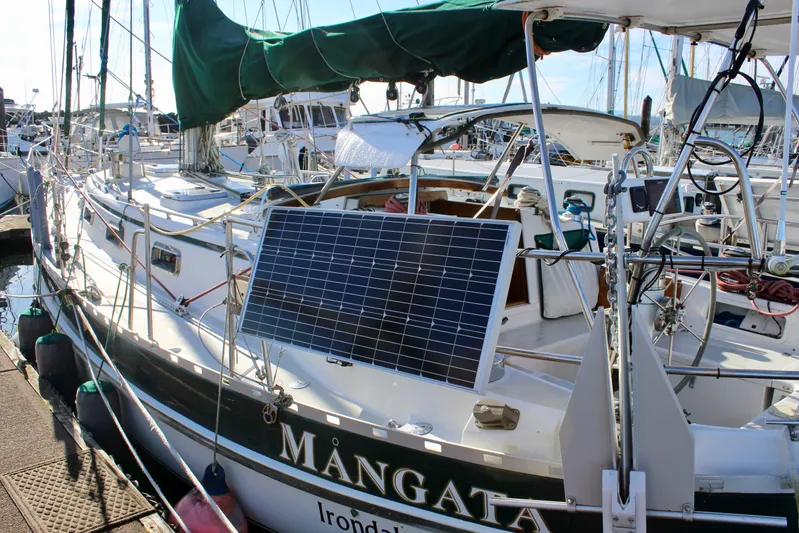 Mangata Yacht Photos Pics Valiant 39 sailboat from 1997 with solar panel, docked at marina.