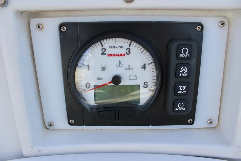 Mangata Yacht Photos Pics Yanmar engine control panel on 1997 Valiant 39 sailboat, featuring RPM gauge and control buttons.