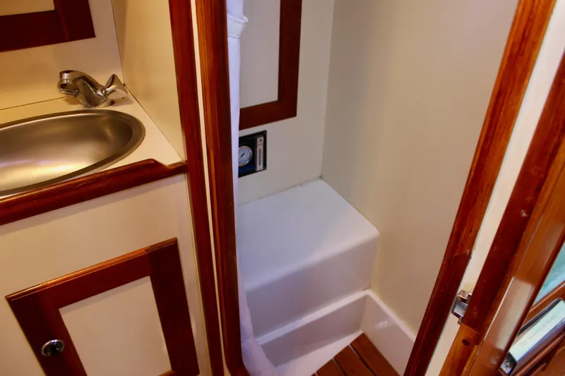 Mangata Yacht Photos Pics 1997 Valiant 39 yacht interior with sink and shower area.