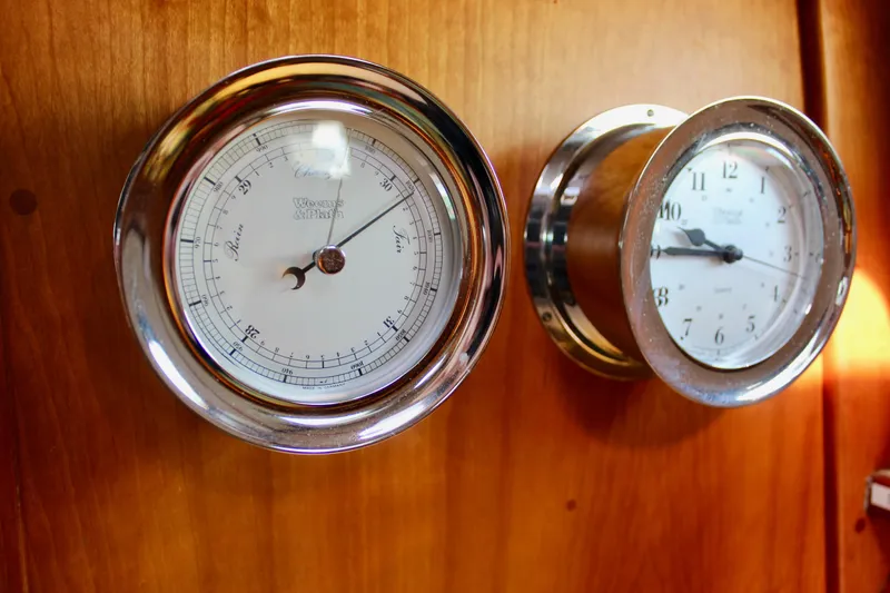 Mangata Yacht Photos Pics Barometer and clock on Valiant 39 yacht, 1997, mounted on wooden panel.