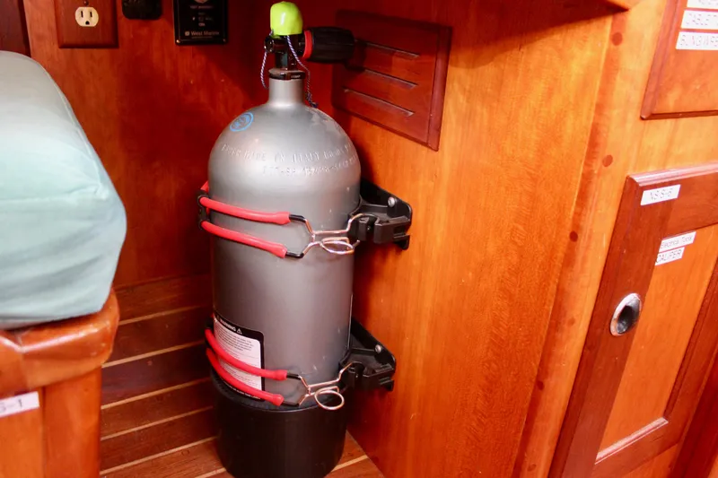 Mangata Yacht Photos Pics Securely mounted scuba tank inside a 1997 Valiant 39 sailboat cabin.