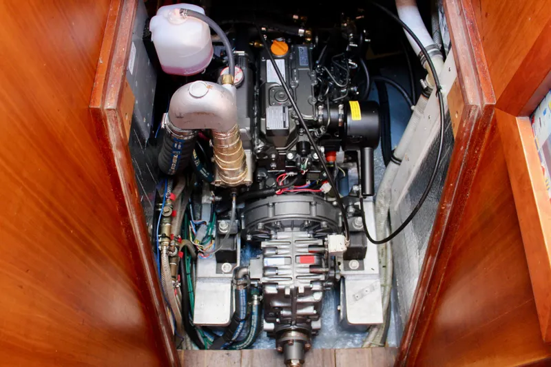 Mangata Yacht Photos Pics Engine compartment of a 1997 Valiant 39 sailboat, showcasing detailed mechanical components.