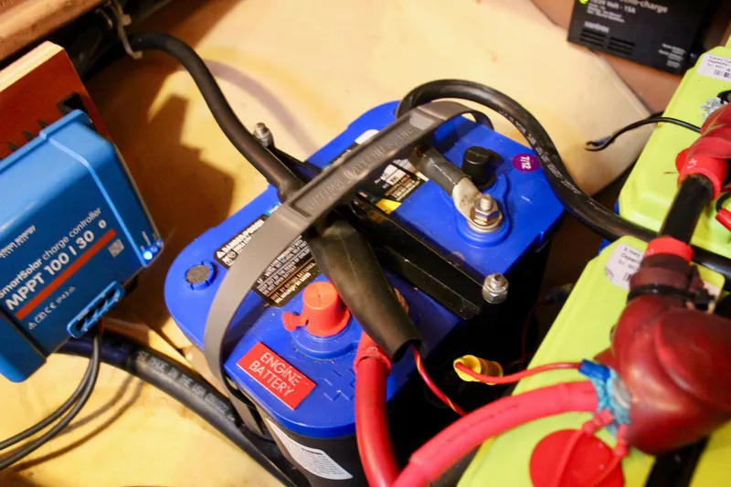 Mangata Yacht Photos Pics Battery setup in a 1997 Valiant 39, featuring MPPT charge controller and wiring connections.