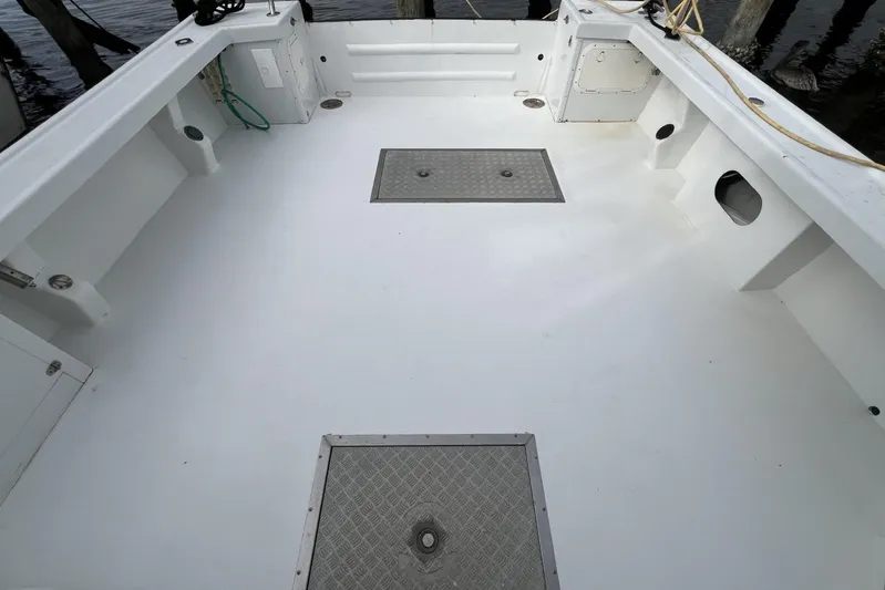  Yacht Photos Pics Spacious deck of 2006 Provincial 42 Lobster Boat, featuring clean white surface and storage hatches.