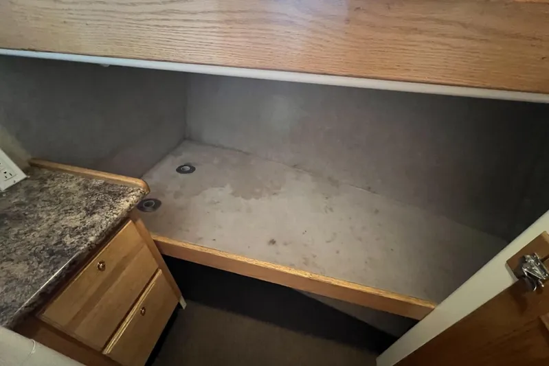  Yacht Photos Pics 2006 Provincial 42 Lobster Boat interior cabin with wooden cabinetry and countertop.