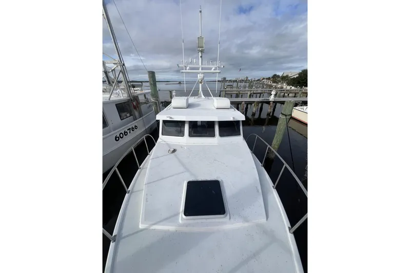  Yacht Photos Pics 2006 Provincial 42 Lobster Boat docked at marina under cloudy sky.