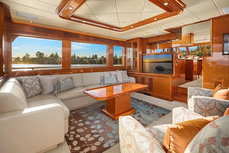 La Bella Vita II Yacht Photos Pics Luxurious interior of 2014 Hampton 720 Skylounge LRC yacht with elegant seating and scenic views.