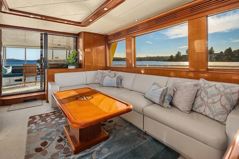 La Bella Vita II Yacht Photos Pics Luxurious interior of 2014 Hampton 720 Skylounge LRC yacht with elegant seating and scenic views.