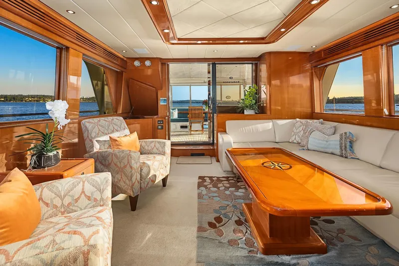 La Bella Vita II Yacht Photos Pics Luxurious interior of 2014 Hampton 720 Skylounge LRC yacht with elegant seating and wooden accents.