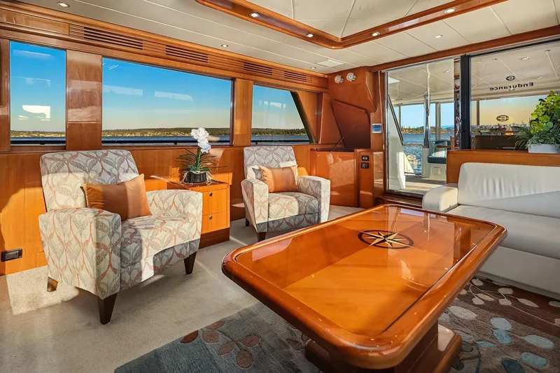 La Bella Vita II Yacht Photos Pics Luxurious interior of 2014 Hampton 720 Skylounge LRC yacht with elegant seating and wooden accents.