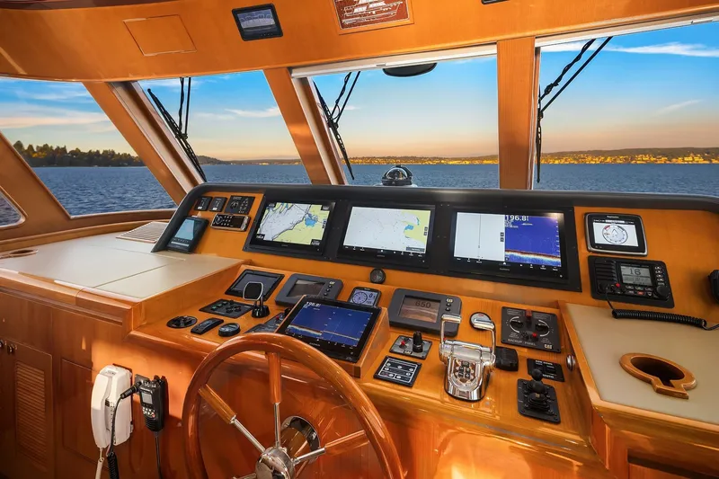 La Bella Vita II Yacht Photos Pics Luxurious 2014 Hampton 720 Skylounge LRC yacht helm with advanced navigation systems.