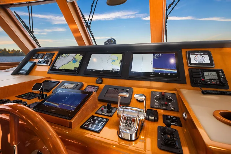 La Bella Vita II Yacht Photos Pics Control panel of 2014 Hampton 720 Skylounge LRC yacht with navigation screens and controls.