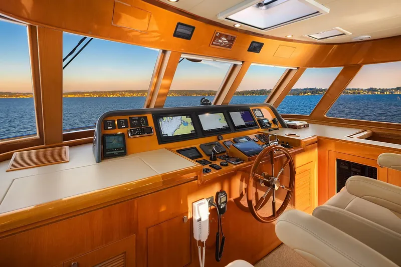 La Bella Vita II Yacht Photos Pics Helm of 2014 Hampton 720 Skylounge LRC yacht with navigation equipment and panoramic sea view.