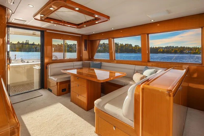 La Bella Vita II Yacht Photos Pics Luxurious interior of 2014 Hampton 720 Skylounge LRC yacht with scenic water views.