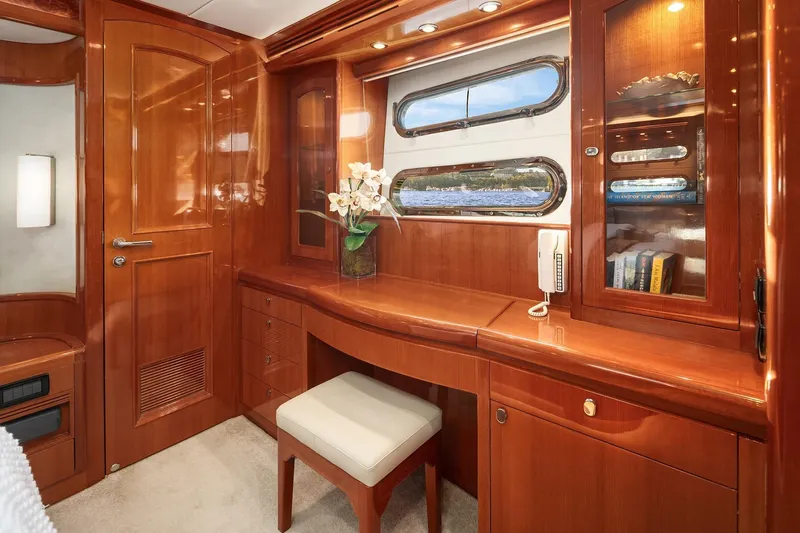 La Bella Vita II Yacht Photos Pics Luxurious wooden interior of 2014 Hampton 720 Skylounge LRC yacht with desk and seating.