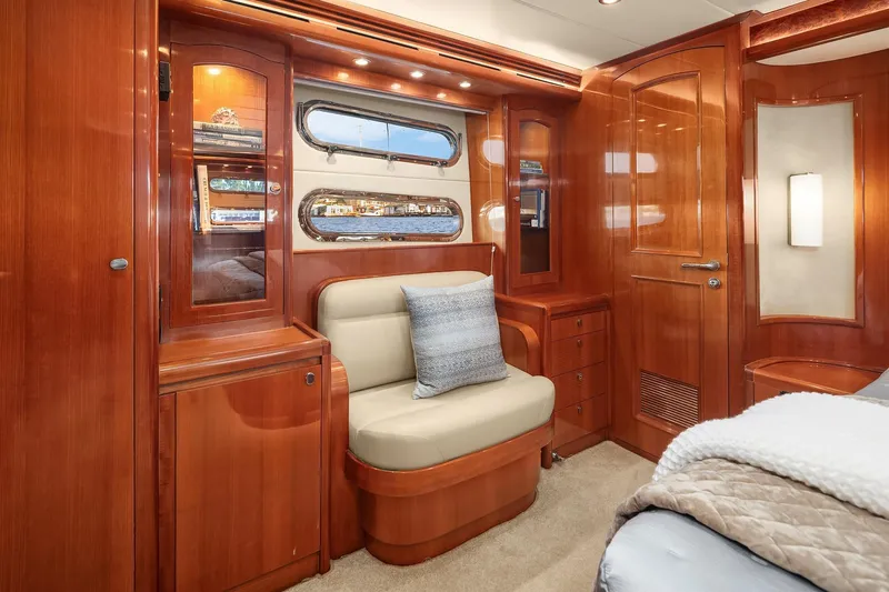 La Bella Vita II Yacht Photos Pics Luxurious 2014 Hampton 720 Skylounge LRC yacht interior with elegant wood finish and cozy seating.