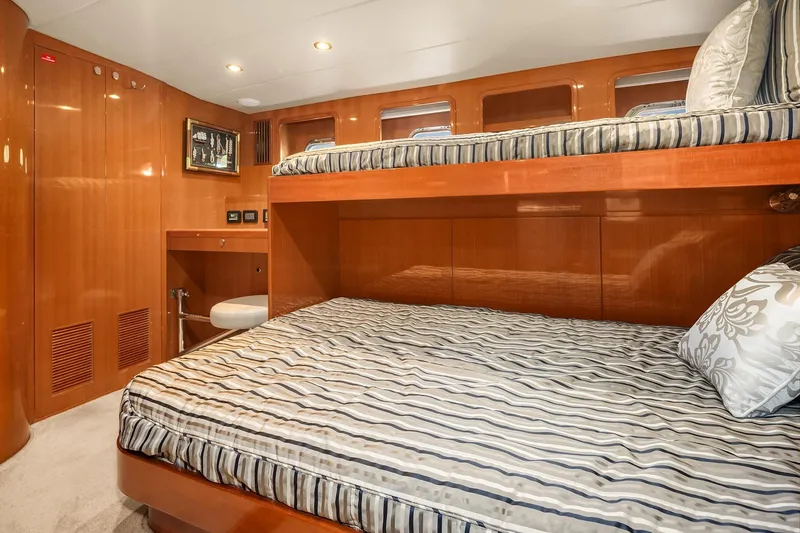 La Bella Vita II Yacht Photos Pics Luxurious cabin interior of 2014 Hampton 720 Skylounge LRC yacht with bunk beds.