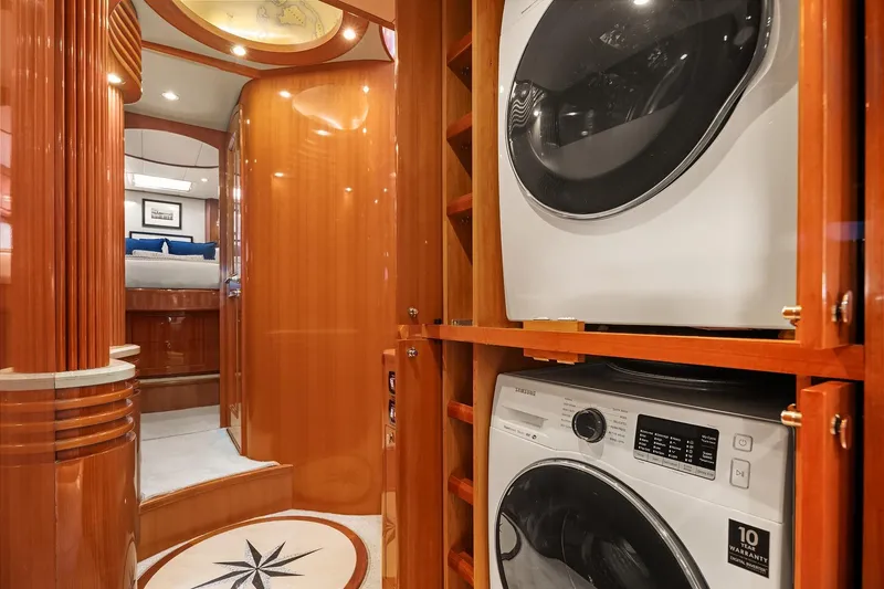 La Bella Vita II Yacht Photos Pics Luxurious 2014 Hampton 720 Skylounge LRC interior with washer and dryer, elegant wood finish.