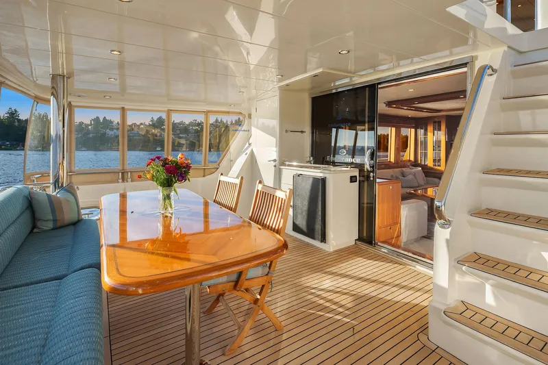 La Bella Vita II Yacht Photos Pics Luxurious 2014 Hampton 720 Skylounge LRC yacht interior with elegant dining area and scenic views.