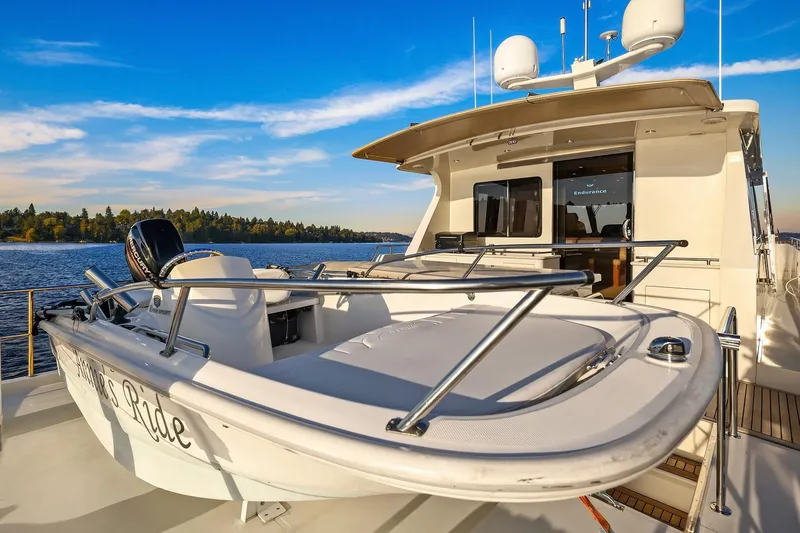 La Bella Vita II Yacht Photos Pics Luxury 2014 Hampton 720 Skylounge LRC yacht on serene water with clear blue sky.