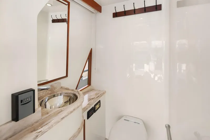 La Bella Vita II Yacht Photos Pics Luxurious bathroom in 2014 Hampton 720 Skylounge LRC yacht with modern fixtures.