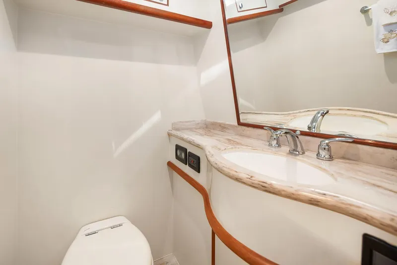 La Bella Vita II Yacht Photos Pics Luxurious bathroom in 2014 Hampton 720 Skylounge LRC yacht with elegant fixtures.