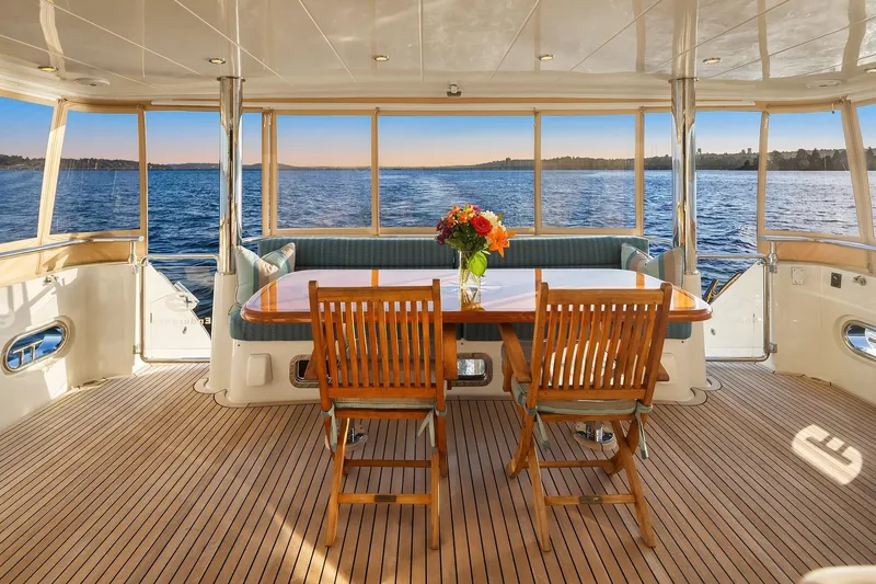 La Bella Vita II Yacht Photos Pics Luxurious 2014 Hampton 720 Skylounge LRC yacht interior with ocean view and elegant dining area.