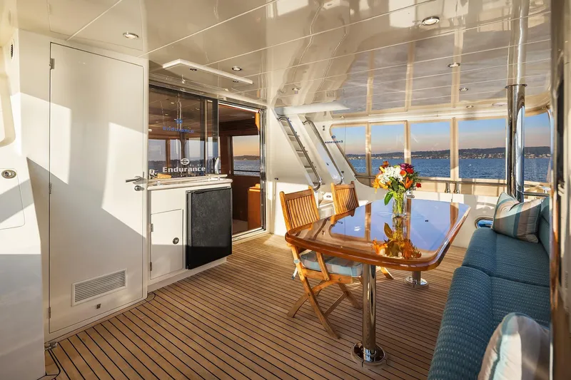 La Bella Vita II Yacht Photos Pics Luxurious interior of 2014 Hampton 720 Skylounge LRC yacht with elegant dining area.