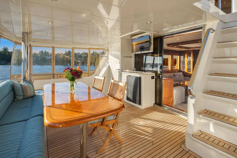 La Bella Vita II Yacht Photos Pics Luxurious 2014 Hampton 720 Skylounge LRC yacht interior with elegant dining area and scenic views.