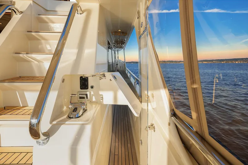 La Bella Vita II Yacht Photos Pics 2014 Hampton 720 Skylounge LRC yacht deck with ocean view at sunset.