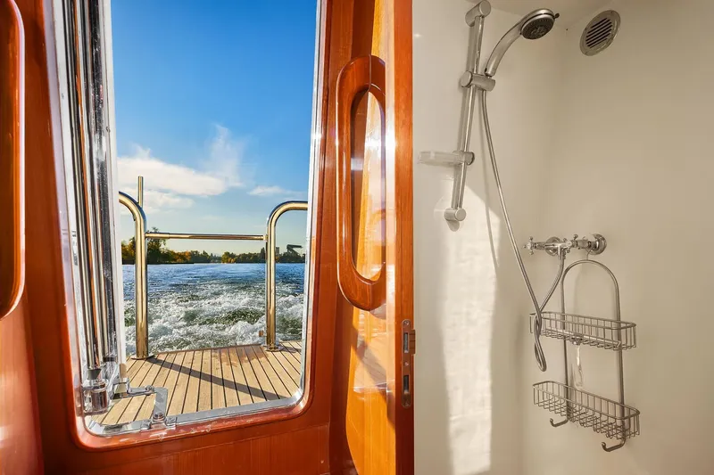La Bella Vita II Yacht Photos Pics Shower view on 2014 Hampton 720 Skylounge LRC yacht, overlooking water and blue sky.