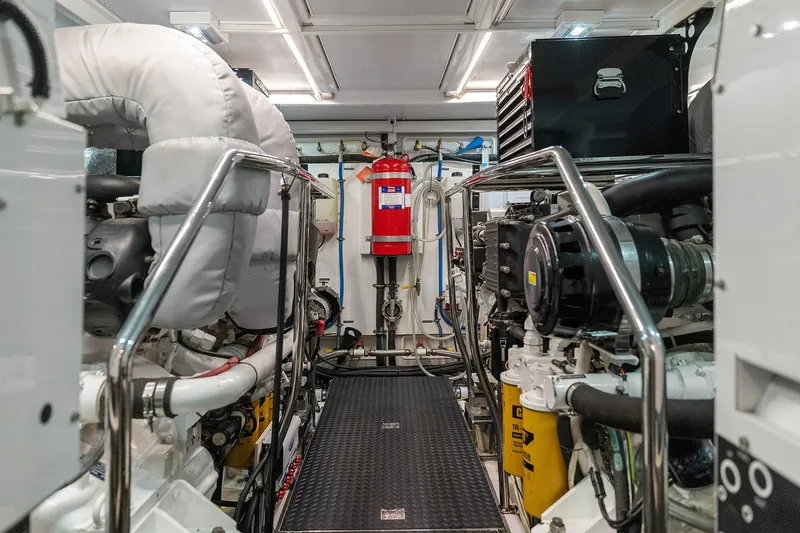 La Bella Vita II Yacht Photos Pics Engine room of 2014 Hampton 720 Skylounge LRC yacht, featuring machinery and safety equipment.