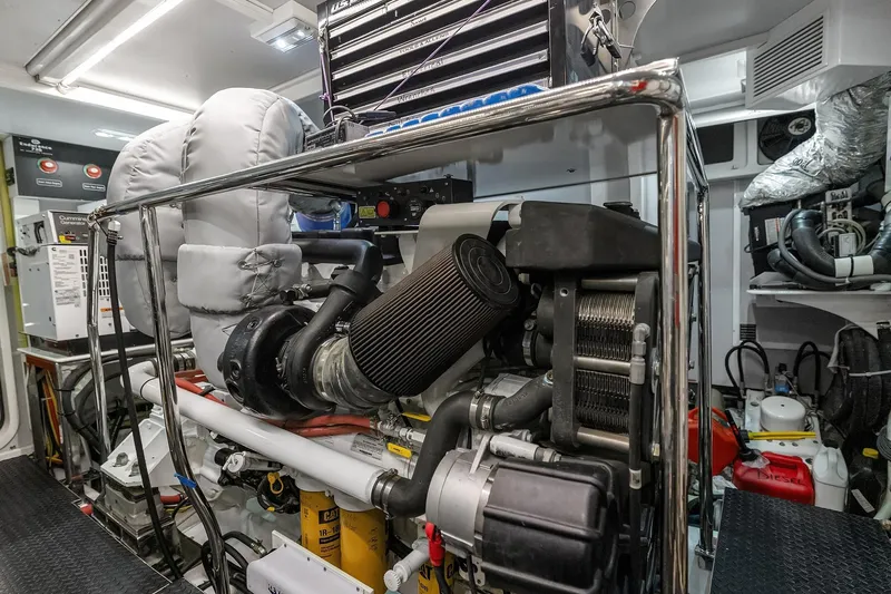 La Bella Vita II Yacht Photos Pics Engine room of 2014 Hampton 720 Skylounge LRC yacht, showcasing mechanical components and equipment.