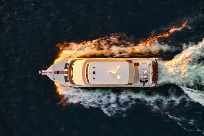 La Bella Vita II Yacht Photos Pics Aerial view of 2014 Hampton 720 Skylounge LRC yacht cruising on open water.