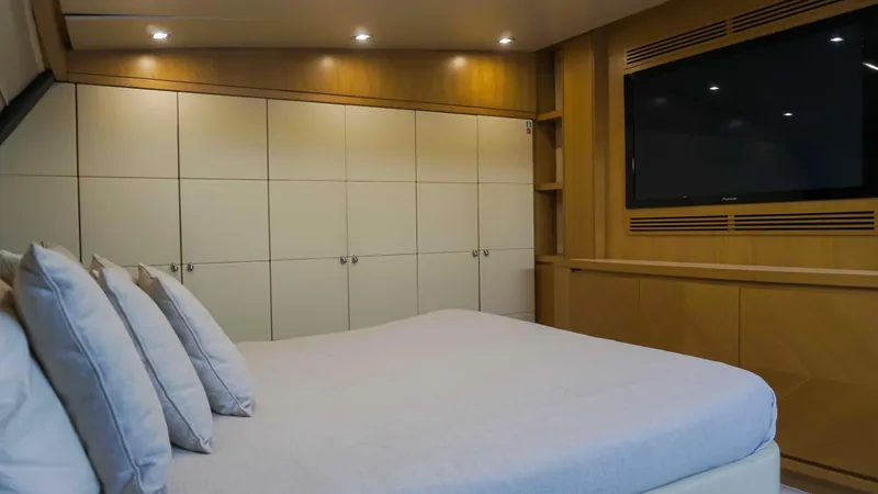 Petrus 2007 Sl108 @livorno Italy Yacht Photos Pics Luxurious bedroom interior on 2007 Sanlorenzo 108 yacht with modern design and large TV.