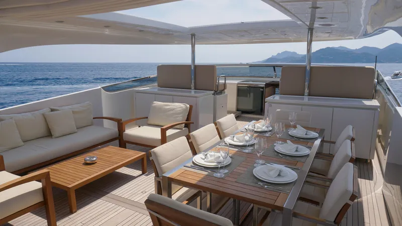 Petrus 2007 Sl108 @livorno Italy Yacht Photos Pics Luxurious 2007 Sanlorenzo 108 yacht deck with elegant dining and seating area.