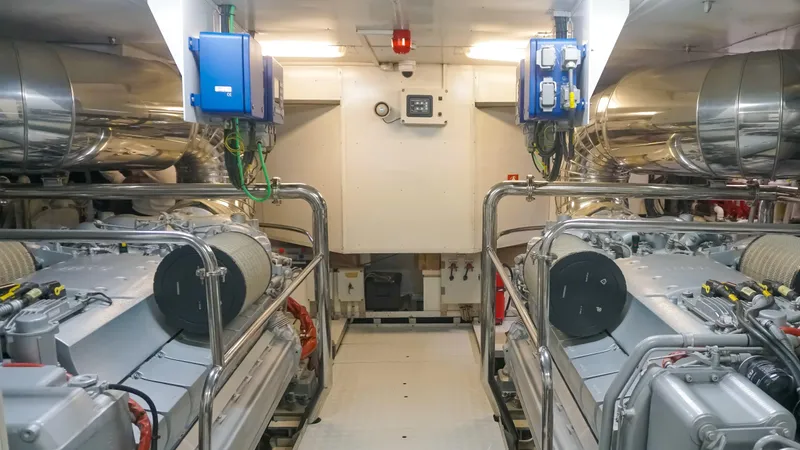 Petrus 2007 Sl108 @livorno Italy Yacht Photos Pics Engine room of 2007 Sanlorenzo 108 yacht, featuring dual engines and control systems.