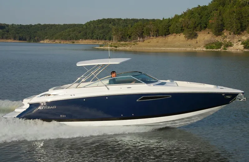  Yacht Photos Pics Manufacturer Provided Image: 2013 Cobalt 336 boat cruising on a lake with forested shoreline.