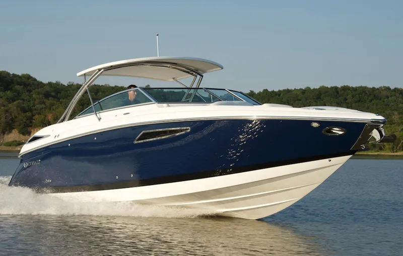  Yacht Photos Pics Manufacturer Provided Image: 2013 Cobalt 336 boat cruising on a lake with forested background.